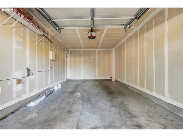 a backyard of a house with barbeque oven table and chairs