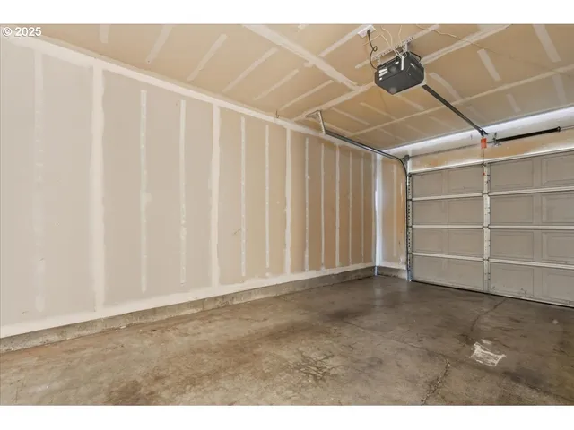 a view of a yard with iron fence