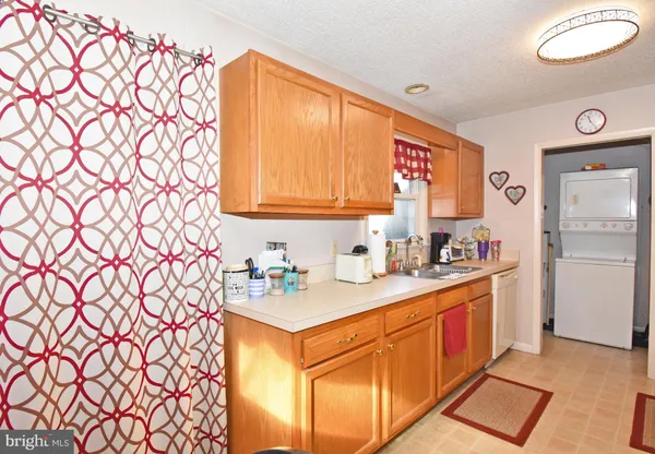a kitchen with sink cabinets and window