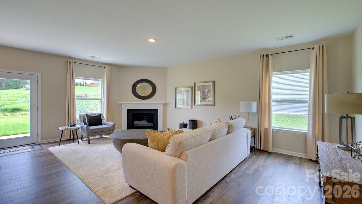 85 Salers Road Fletcher, NC 28732 - Photo 12 of 46 a living room with furniture and a fireplace