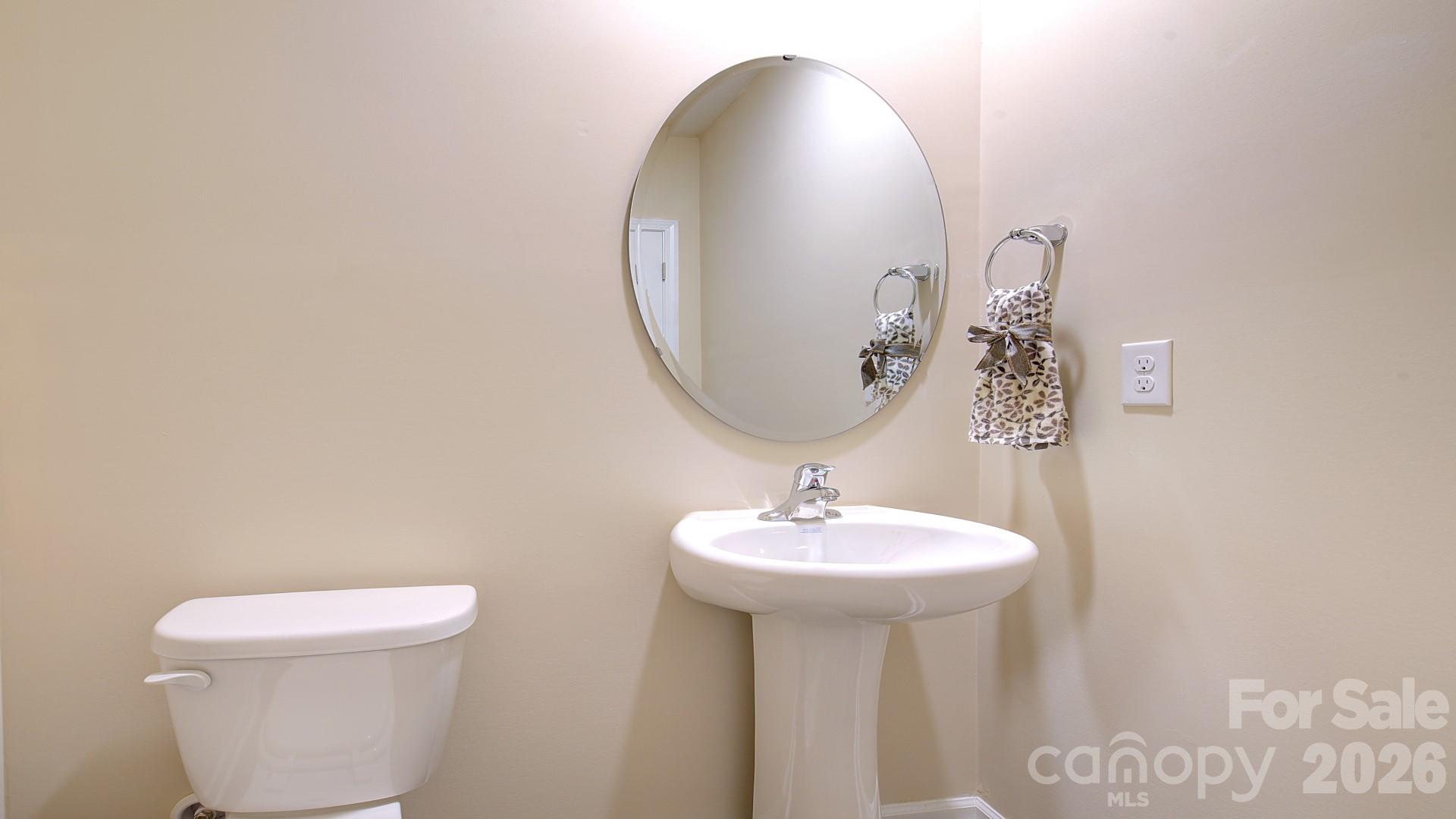 85 Salers Road Fletcher, NC 28732 - Photo 15 of 46 a bathroom with a sink a mirror and toilet
