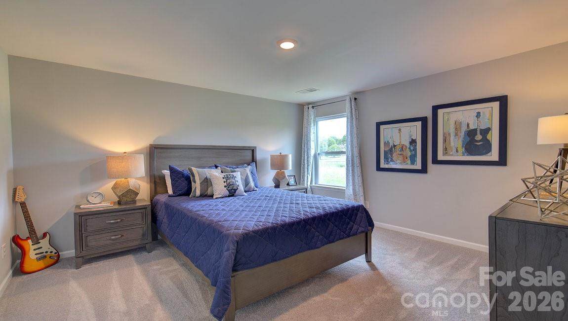 85 Salers Road Fletcher, NC 28732 - Photo 23 of 46 a bedroom with a bed and a cabinets