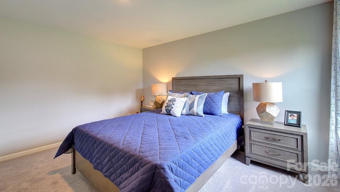 85 Salers Road Fletcher, NC 28732 - Photo 24 of 46 a bedroom with a bed and a night stand