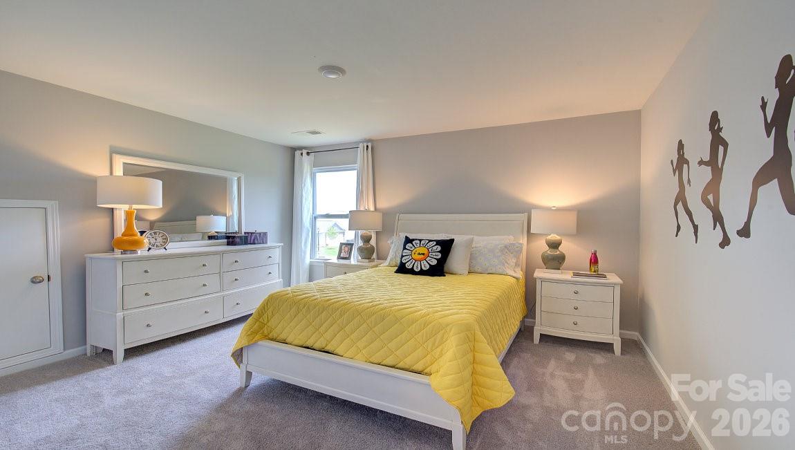 85 Salers Road Fletcher, NC 28732 - Photo 26 of 46 a bedroom with a bed and a dresser