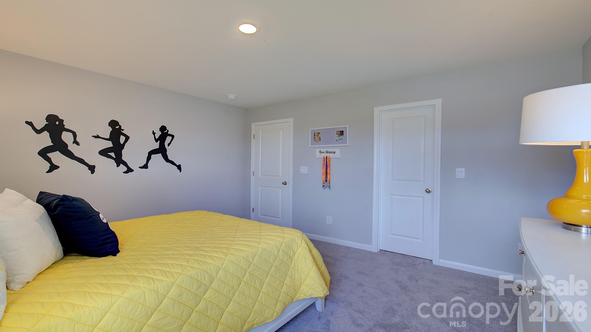 85 Salers Road Fletcher, NC 28732 - Photo 28 of 46 a bedroom with a bed and a painting on the wall