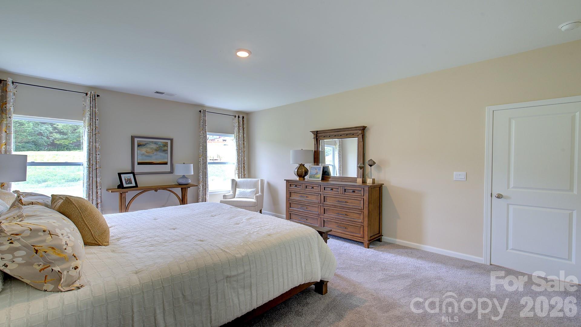 85 Salers Road Fletcher, NC 28732 - Photo 35 of 46 a bedroom with a large bed and wooden floor