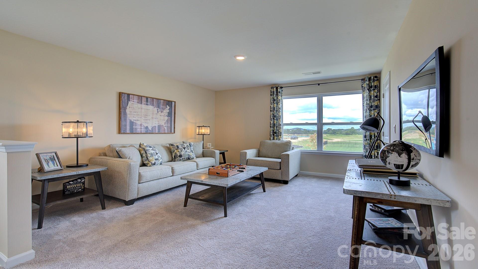 85 Salers Road Fletcher, NC 28732 - Photo 37 of 46 a living room with furniture and a large window