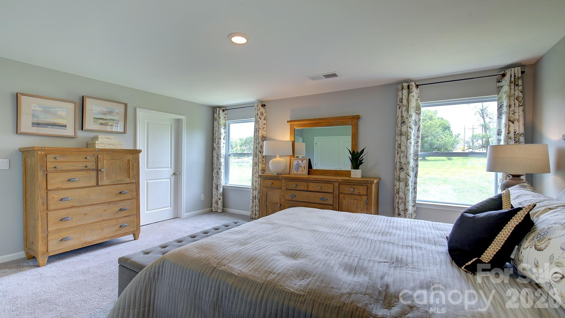 85 Salers Road Fletcher, NC 28732 - Photo 38 of 46 a bedroom with a bed and wooden floor