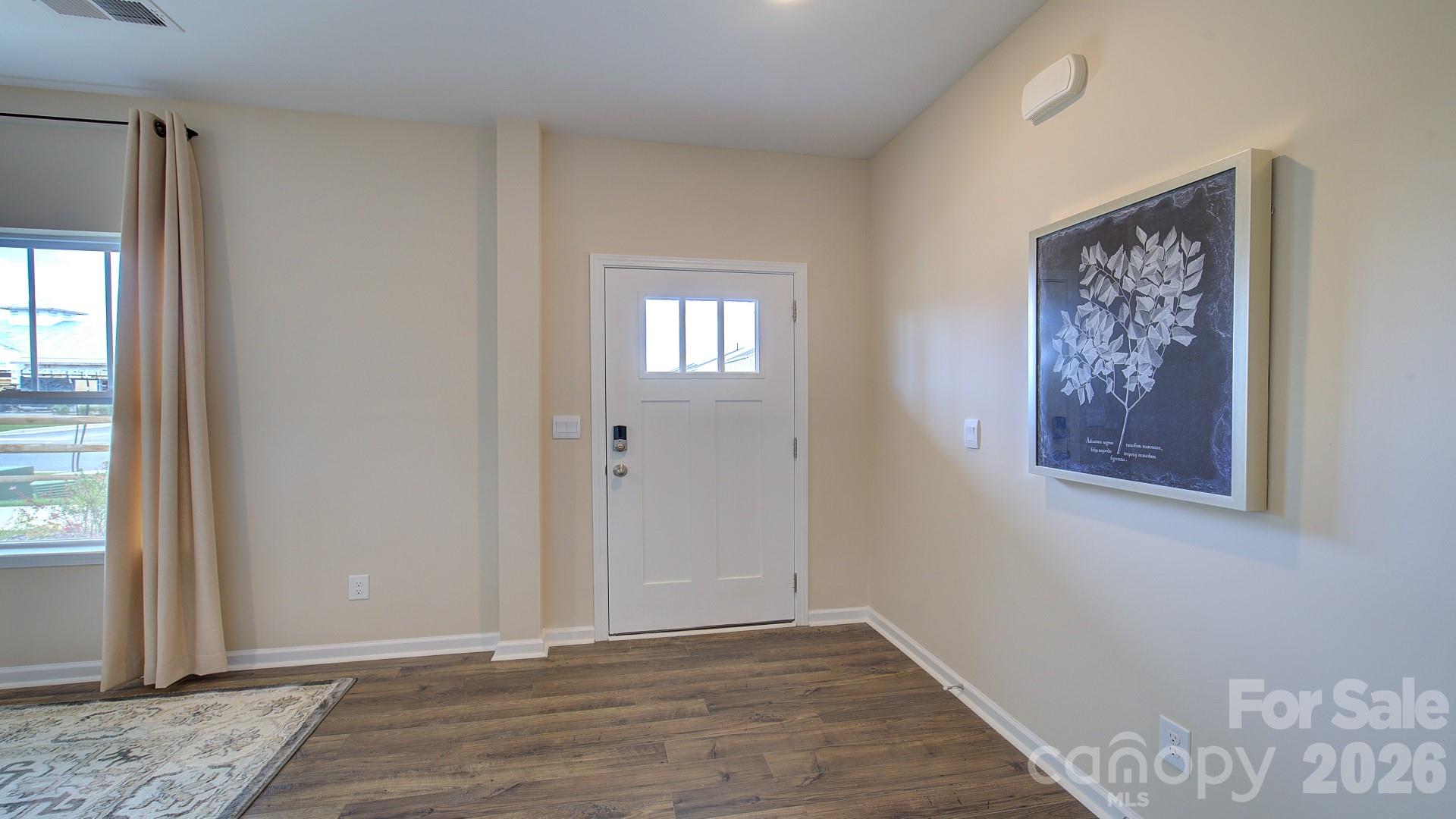 85 Salers Road Fletcher, NC 28732 - Photo 4 of 46 a view of an entryway with wooden floor