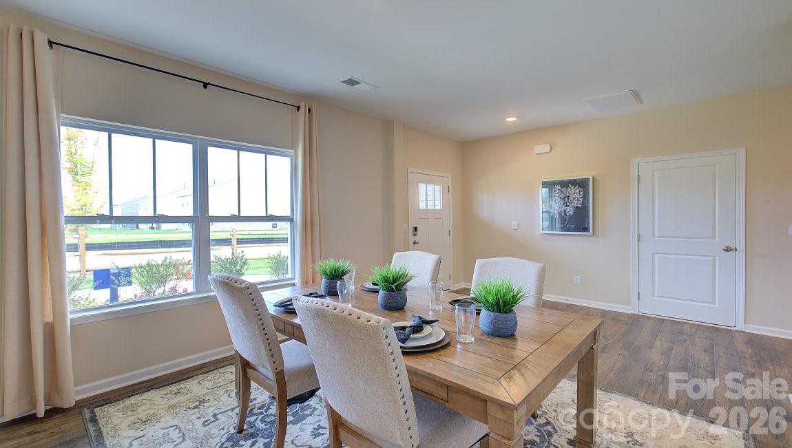 85 Salers Road Fletcher, NC 28732 - Photo 5 of 46 a view of a dining room with furniture a rug and wooden floor