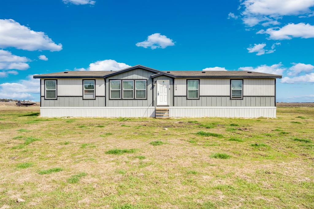 129 Old Blooming Grove Road Italy, TX 76651 - Photo 1 of 22 a front view of a house with a yard
