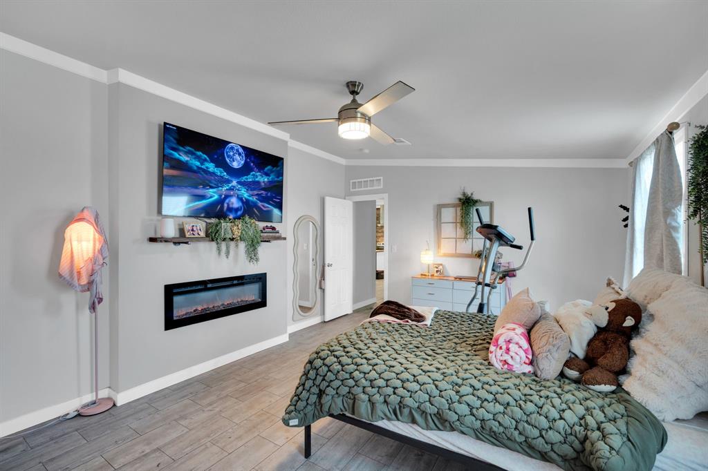 129 Old Blooming Grove Road Italy, TX 76651 - Photo 14 of 22 a bedroom with bed and wooden floor