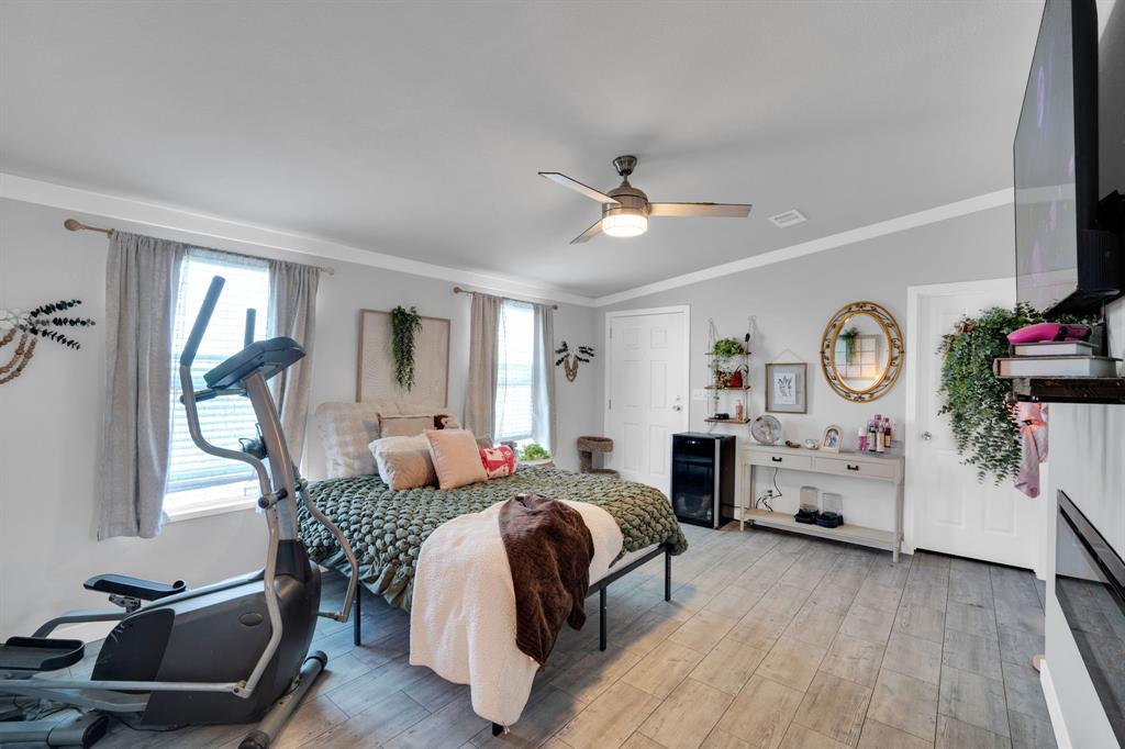 129 Old Blooming Grove Road Italy, TX 76651 - Photo 18 of 22 a bedroom with furniture and a wooden floor