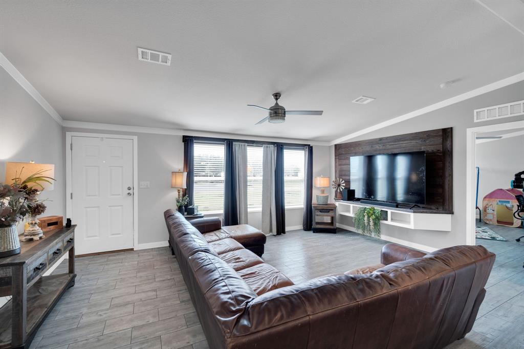 129 Old Blooming Grove Road Italy, TX 76651 - Photo 3 of 22 a living room with furniture and a flat screen tv