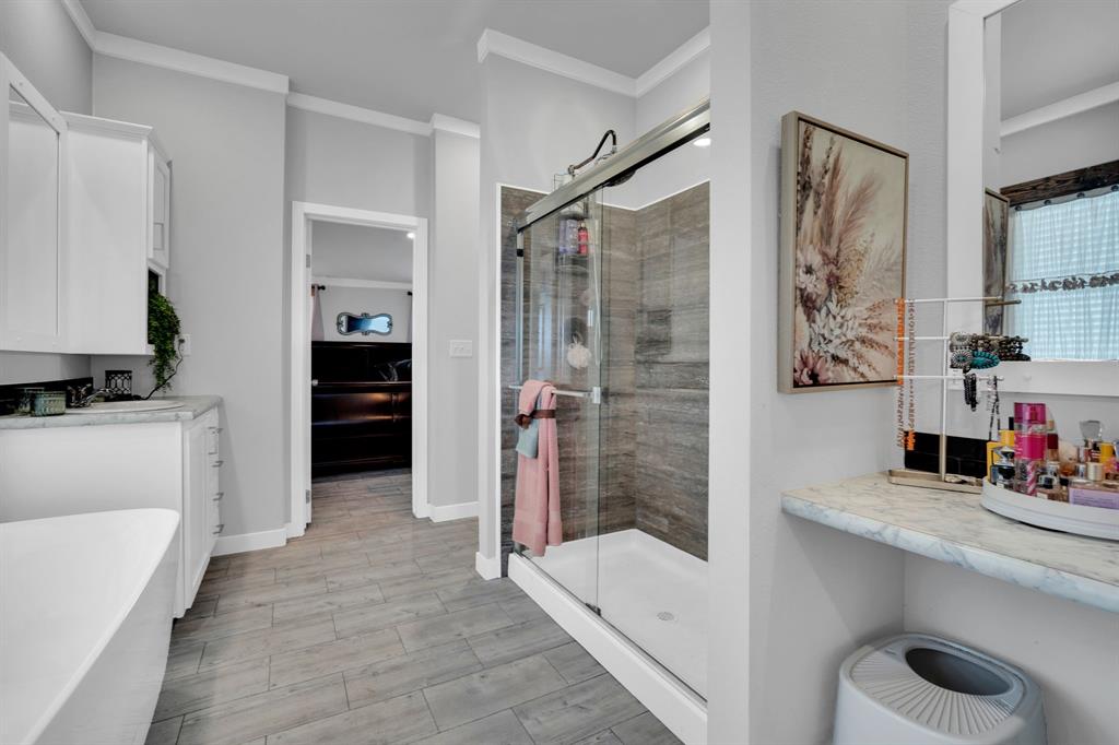 129 Old Blooming Grove Road Italy, TX 76651 - Photo 10 of 22 a bathroom with a tub sink and mirror