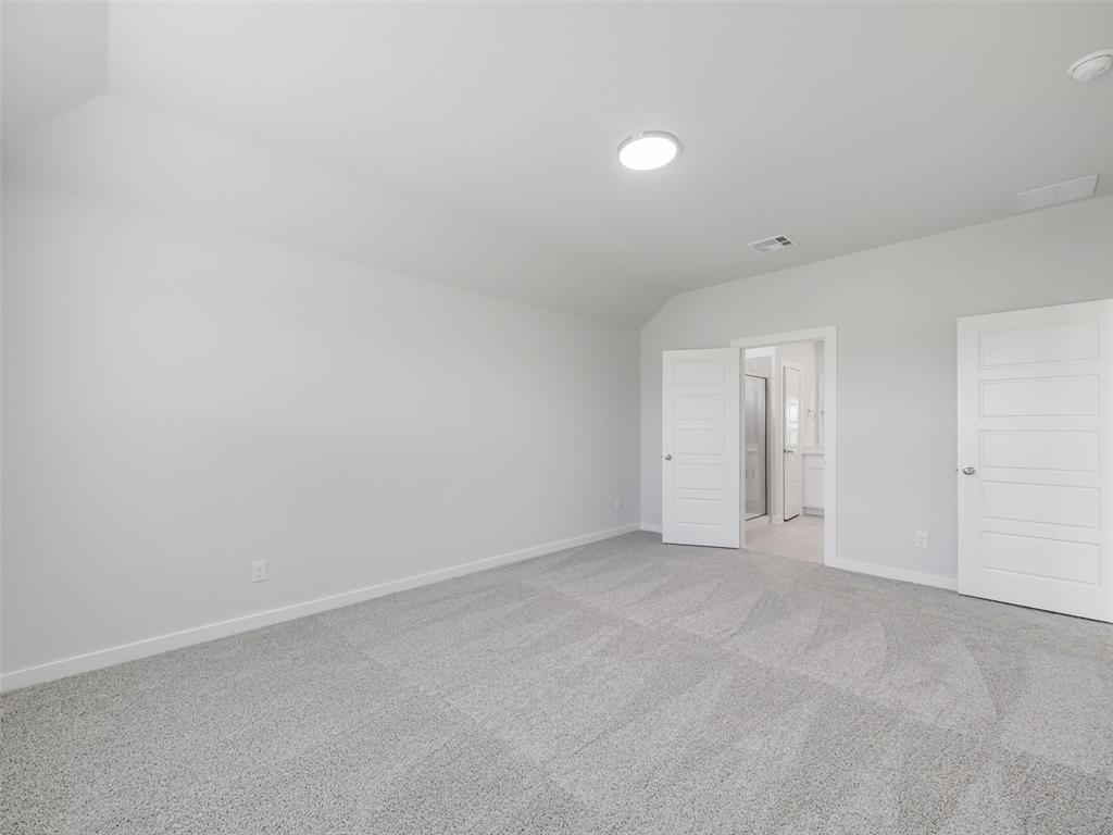 1136 Del Rio Drive Lavon, TX 75166 - Photo 16 of 30 Spacious room featuring light gray carpeting, white walls, and a contemporary flush-mount ceiling light