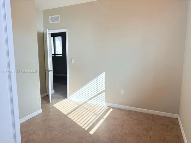 a view of wooden floor and closet