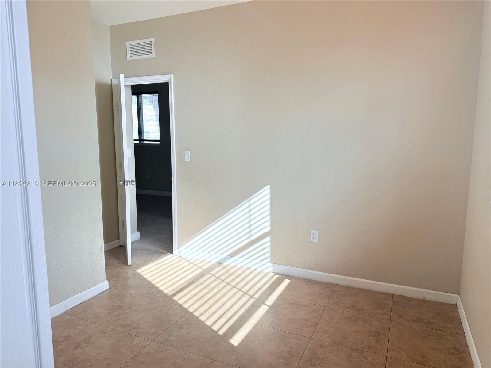 1656 Southeast 29th Court, Unit 207 Homestead, FL 33035 - Photo 13 of 31 a view of wooden floor and closet