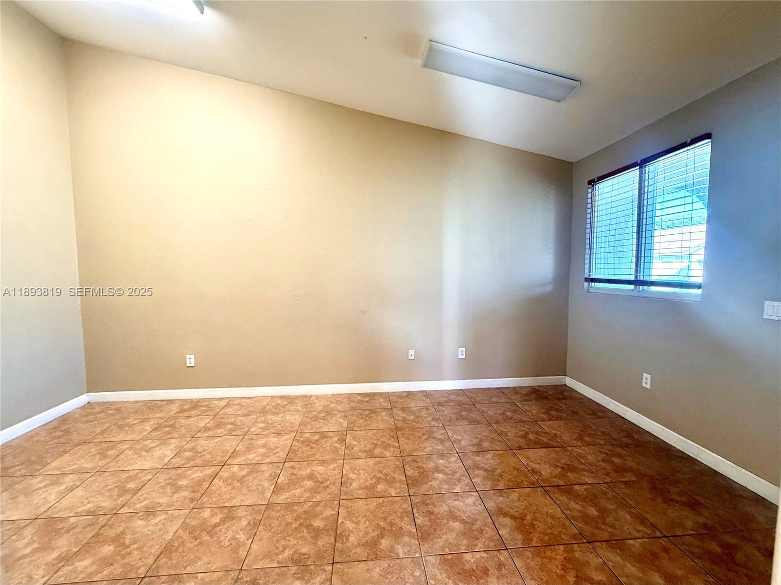 1656 Southeast 29th Court, Unit 207 Homestead, FL 33035 - Photo 20 of 31 a view of an empty room