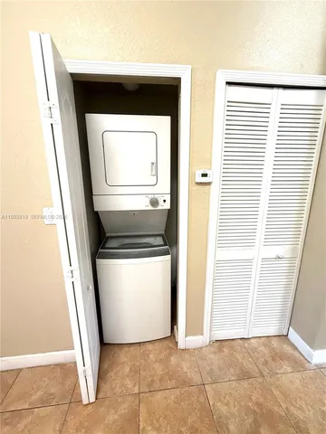 a stove top oven sitting inside of a kitchen