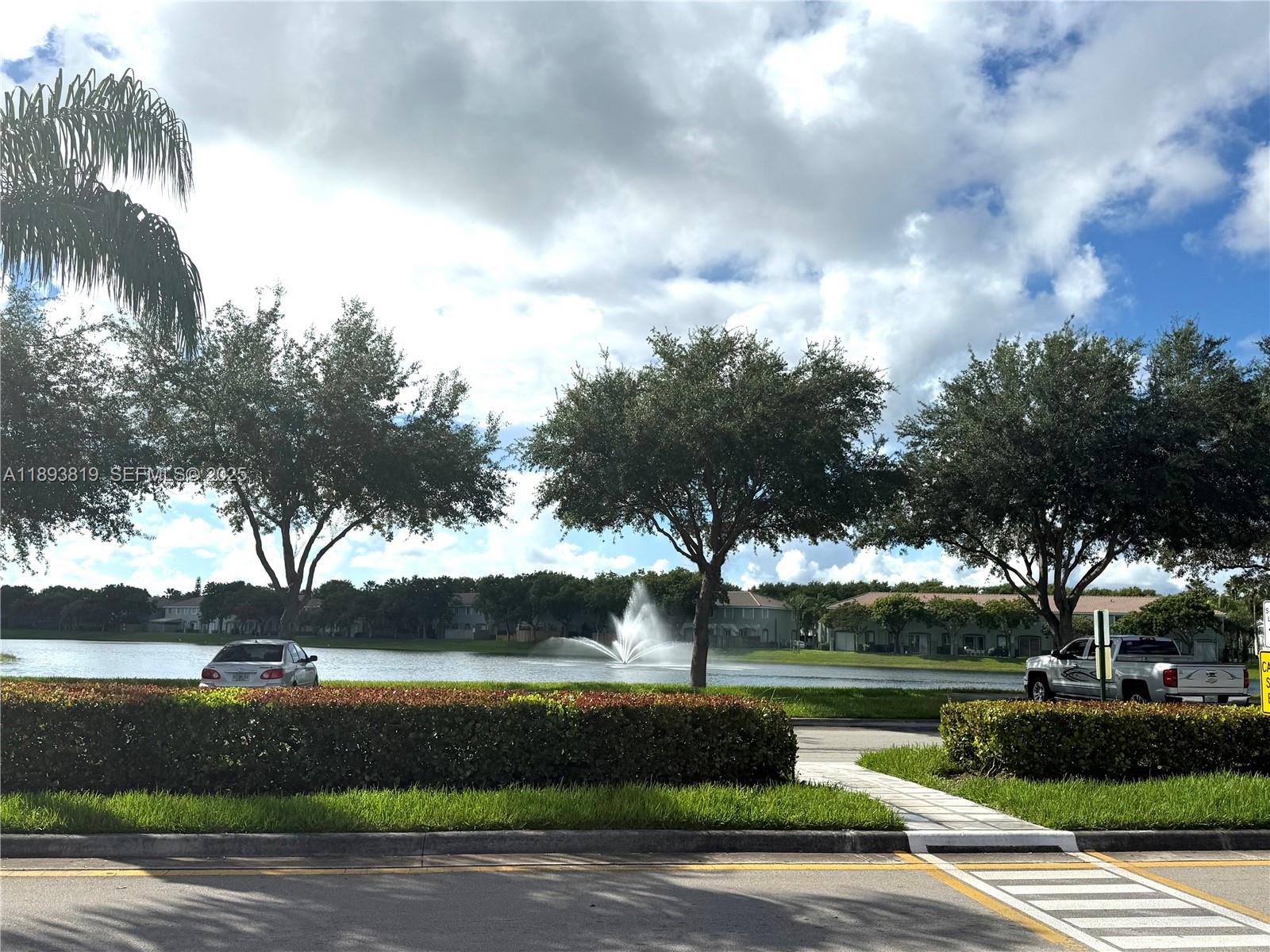 1656 Southeast 29th Court, Unit 207 Homestead, FL 33035 - Photo 25 of 31 a view of lake with green space
