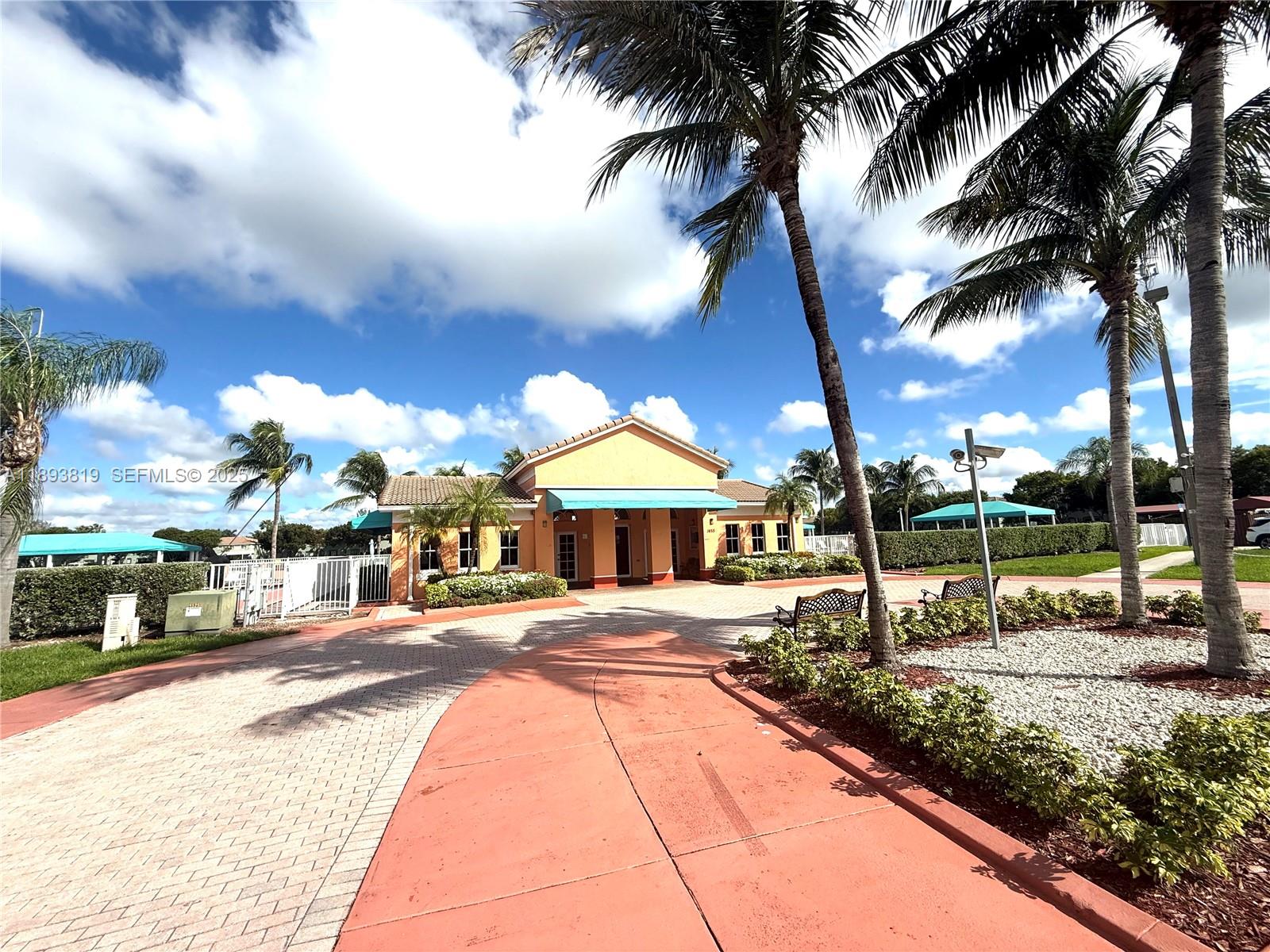 1656 Southeast 29th Court, Unit 207 Homestead, FL 33035 - Photo 26 of 31 a swimming pool with outdoor seating and yard