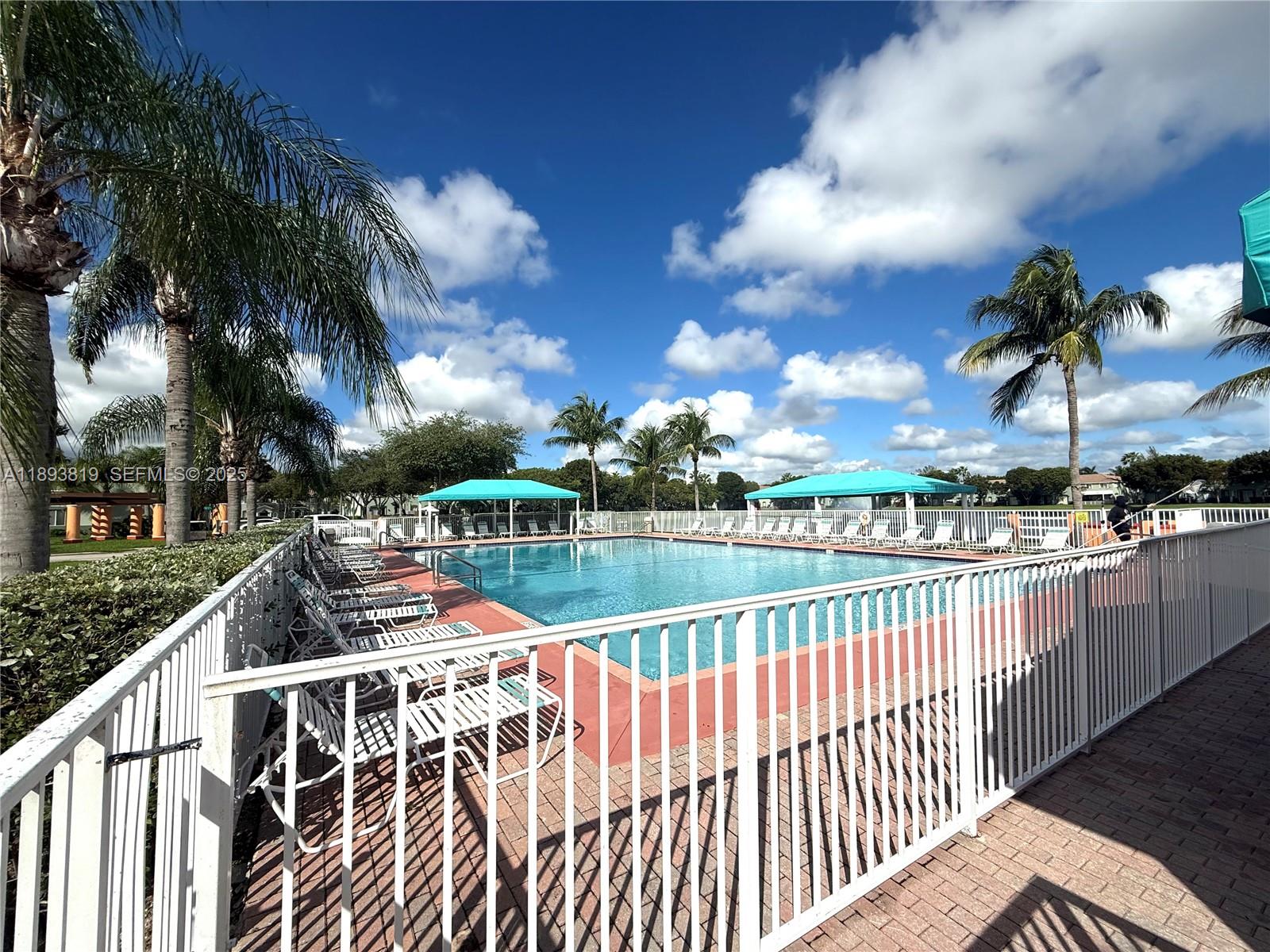 1656 Southeast 29th Court, Unit 207 Homestead, FL 33035 - Photo 29 of 31 a view of a swimming pool with a patio