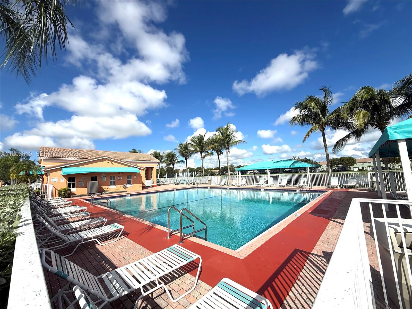 1656 Southeast 29th Court, Unit 207 Homestead, FL 33035 - Photo 30 of 31 a view of a patio with swimming pool