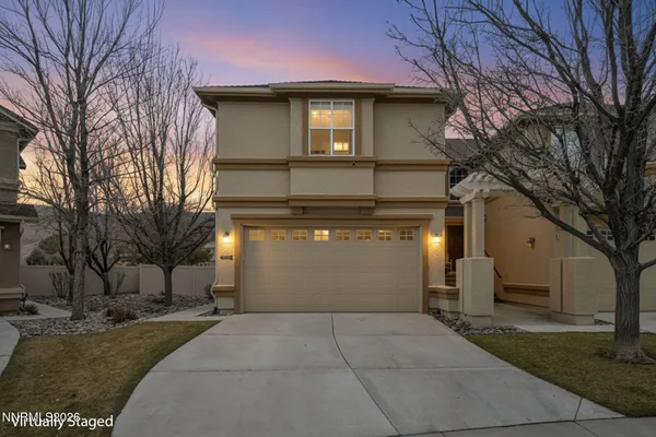 a front view of a house with yard
