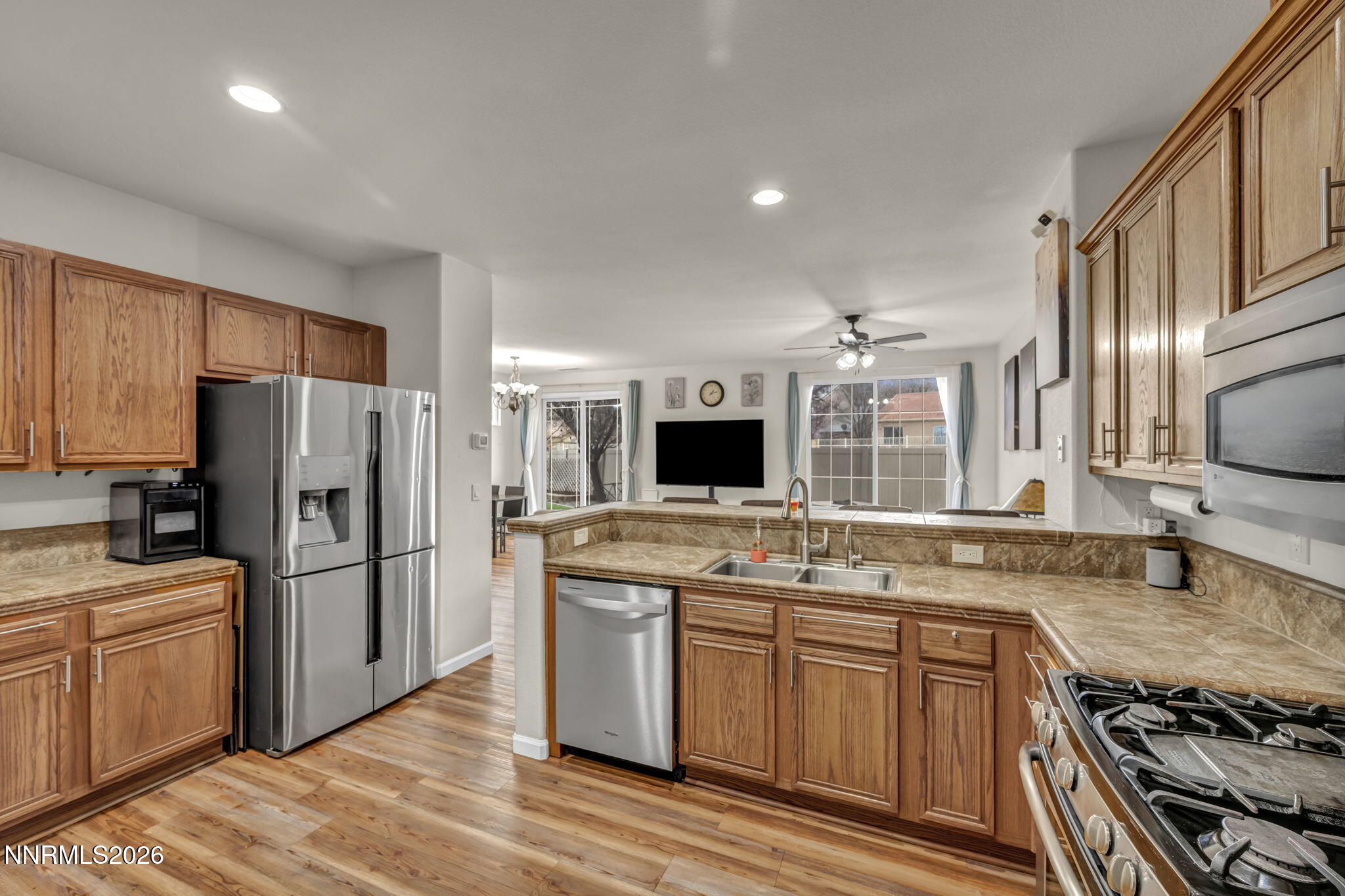 11010 Colton Drive Reno, NV 89521 - Photo 11 of 27 a kitchen with a sink stove and refrigerator