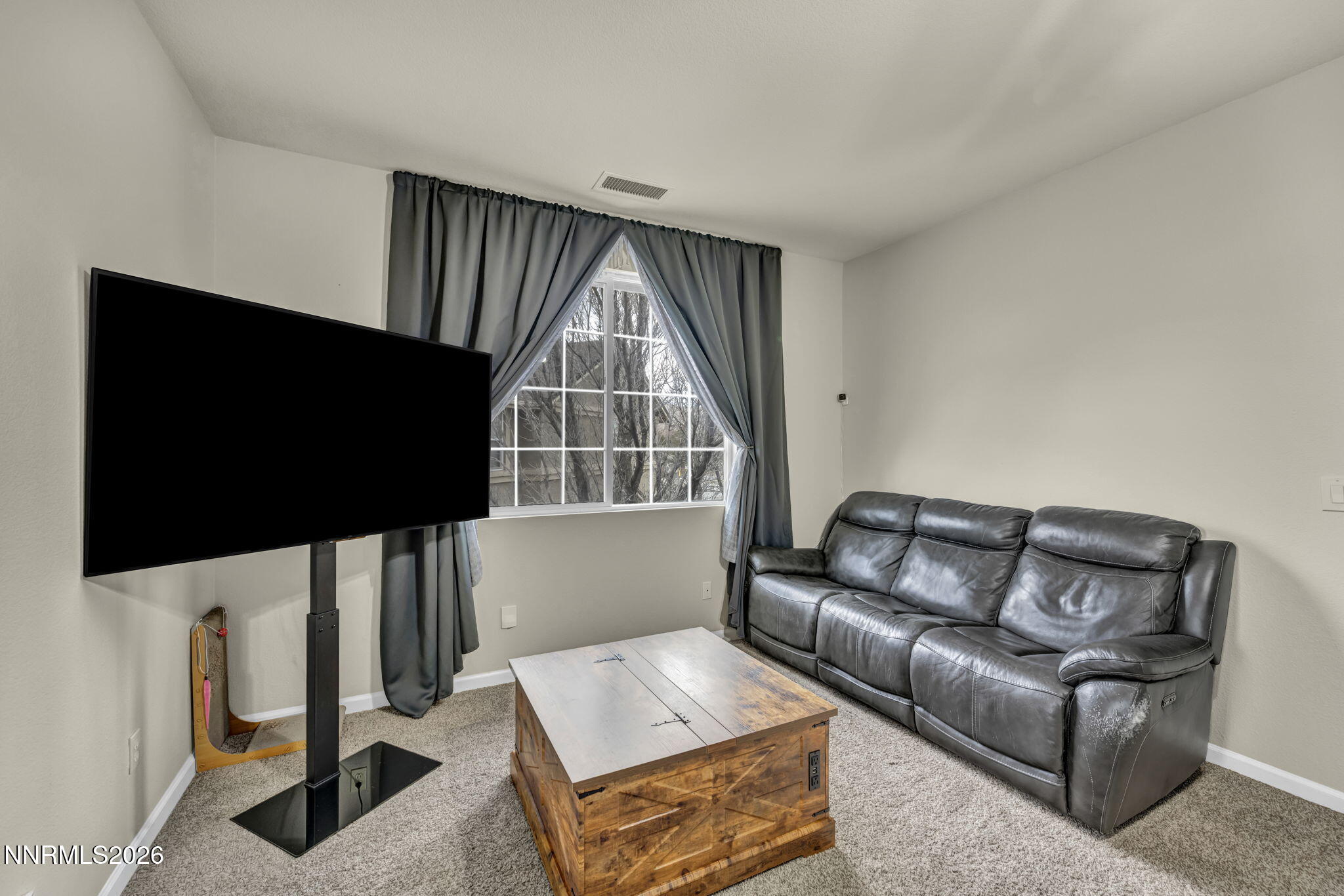 11010 Colton Drive Reno, NV 89521 - Photo 13 of 27 a living room with furniture and a flat screen tv
