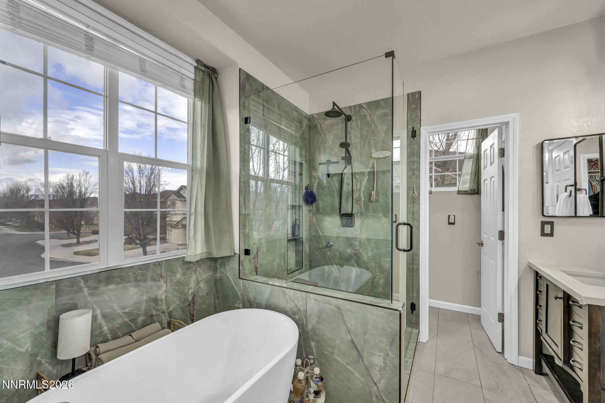 11010 Colton Drive Reno, NV 89521 - Photo 15 of 27 a bathroom with a shower and a sink