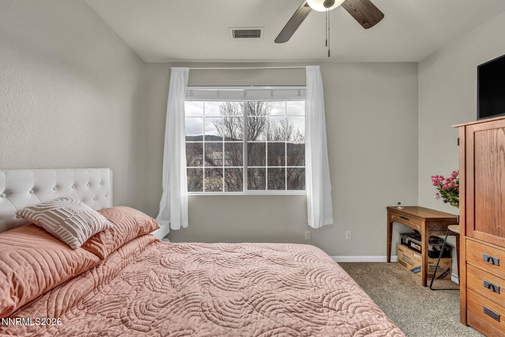 11010 Colton Drive Reno, NV 89521 - Photo 17 of 27 a bedroom with a bed and a window