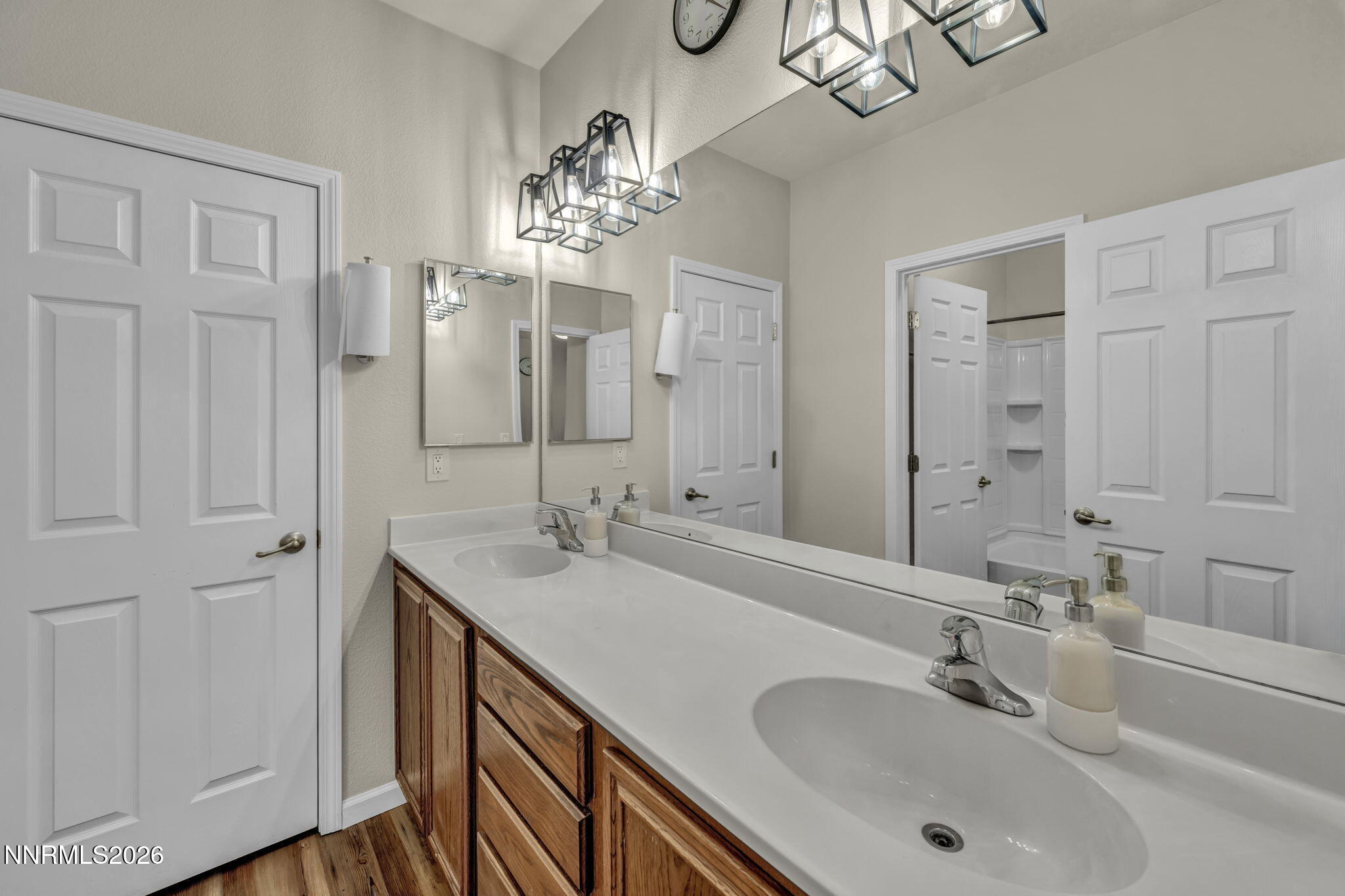 11010 Colton Drive Reno, NV 89521 - Photo 22 of 27 a bathroom with double vanity sinks and a mirror