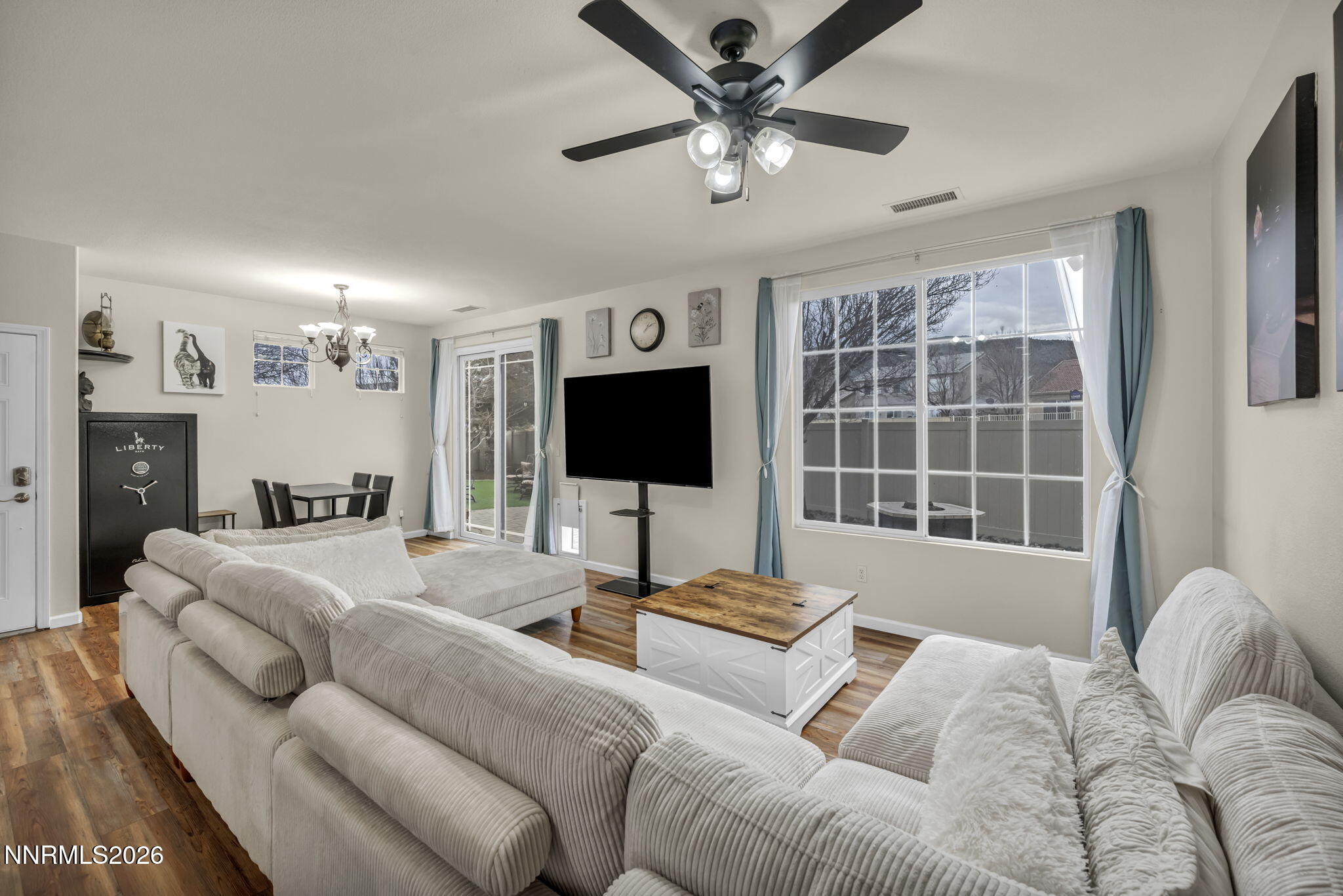 11010 Colton Drive Reno, NV 89521 - Photo 6 of 27 a living room with furniture and a flat screen tv