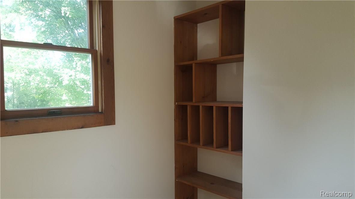 130 Mason Road Howell, MI 48843 - Photo 18 of 33 Built in shelves in den or library.jpg