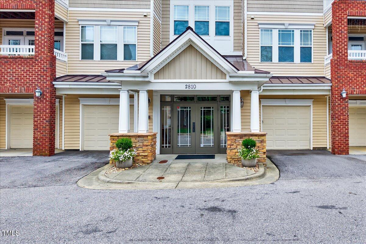 Undisclosed Address Raleigh, NC 27604 - Photo 1 of 22 a front view of a house with a sitting area
