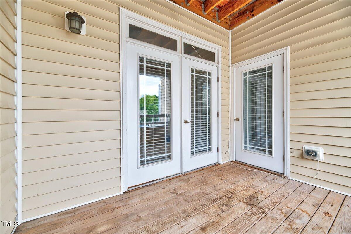Undisclosed Address Raleigh, NC 27604 - Photo 12 of 22 a view of a house with a door and wooden floor