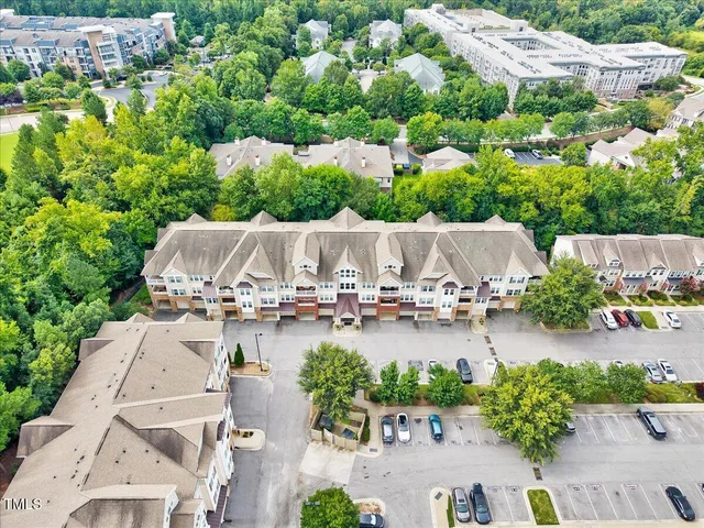 an aerial view of a swimming pool and outdoor space