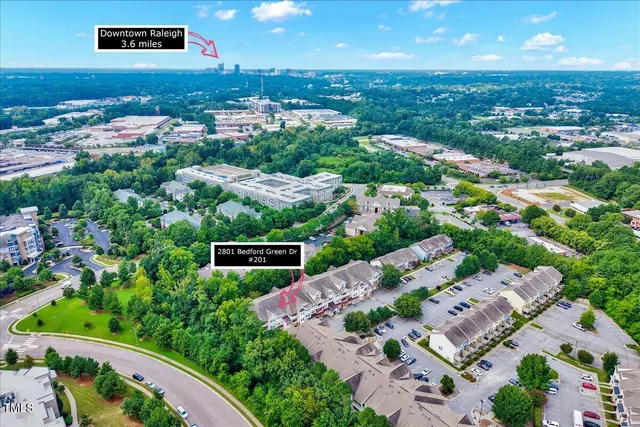 an aerial view of a house with yard swimming pool and outdoor seating