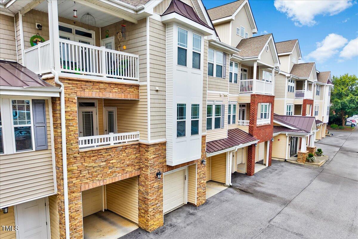 Undisclosed Address Raleigh, NC 27604 - Photo 2 of 22 a view of a brick building with a window and balcony
