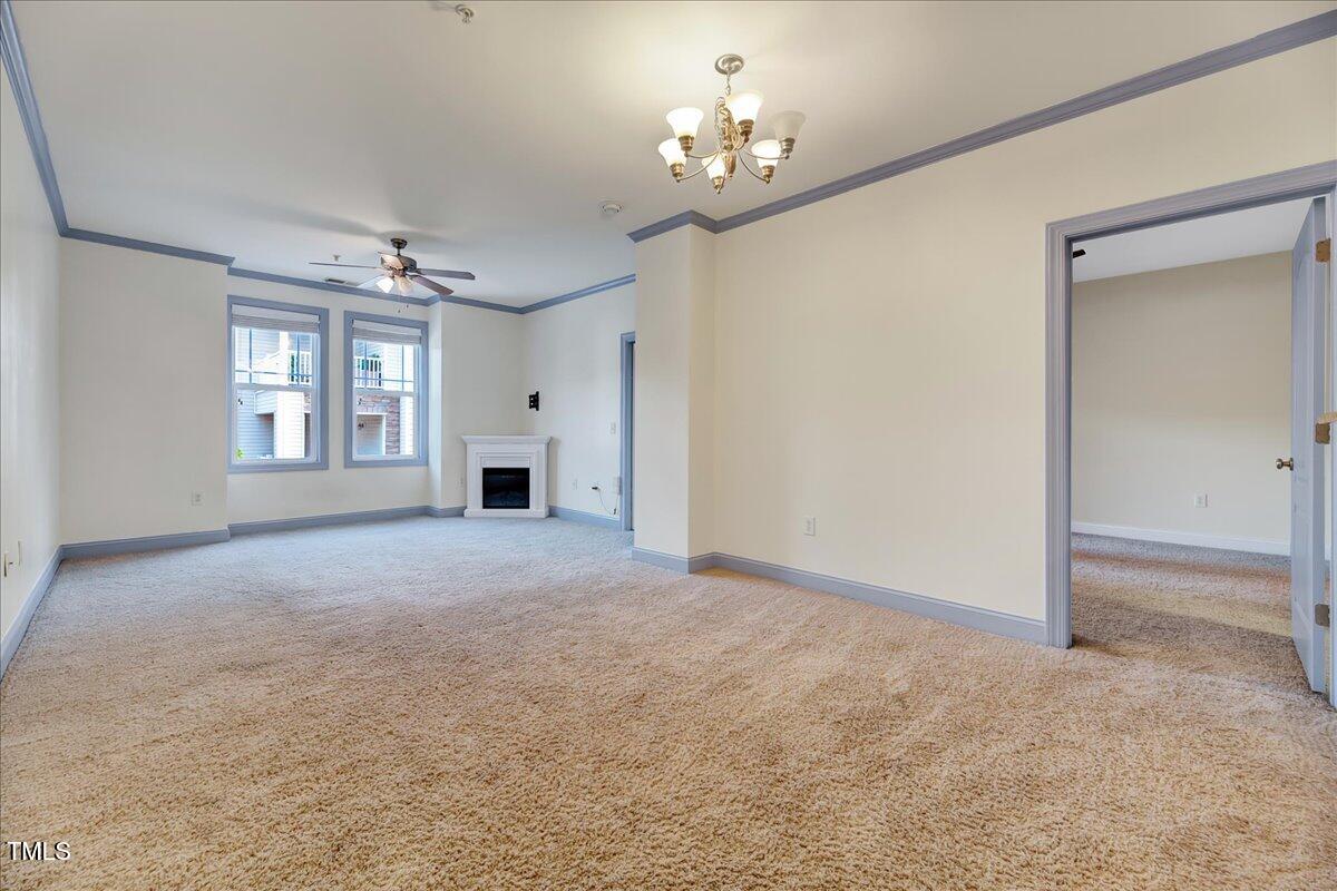 Undisclosed Address Raleigh, NC 27604 - Photo 5 of 22 a view of a big room with windows and chandelier fan
