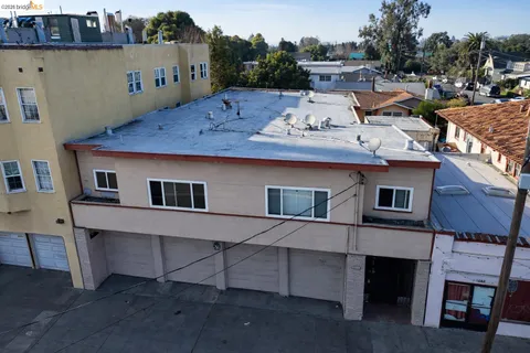a view of a house with pool table and chairs