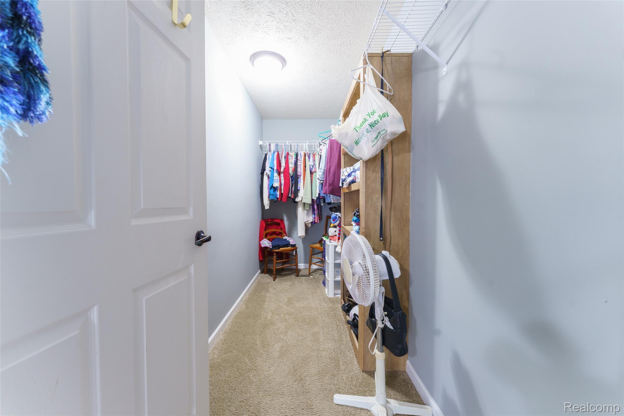 5601 West Lovejoy Road Byron, MI 48418 - Photo 17 of 40 Spacious closet featuring carpet floors