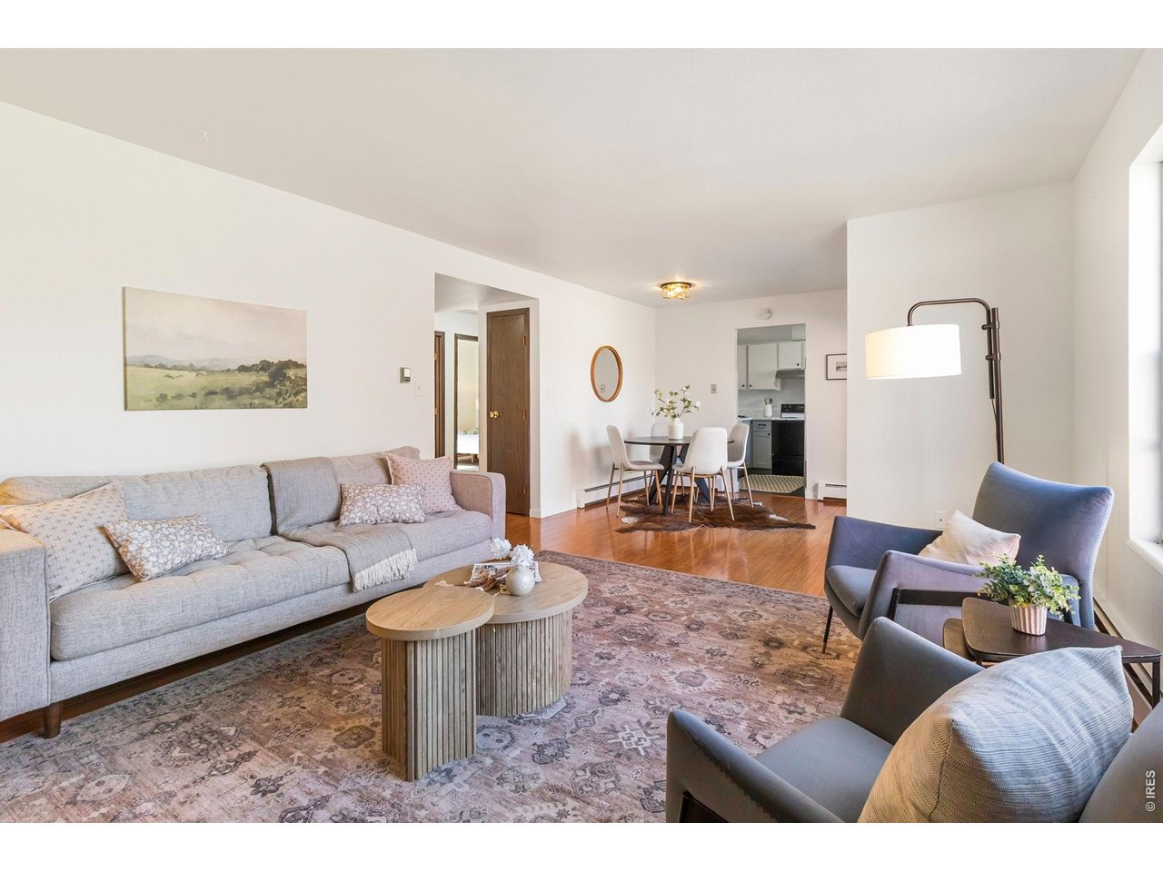 1625 West Elizabeth Street, Unit 1 Fort Collins, CO 80521 - Photo 2 of 16 a living room with furniture and wooden floor