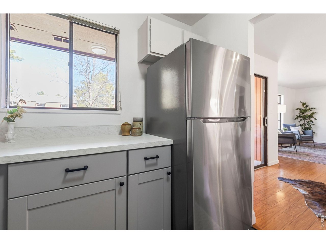 1625 West Elizabeth Street, Unit 1 Fort Collins, CO 80521 - Photo 6 of 16 a kitchen with a refrigerator and a sink