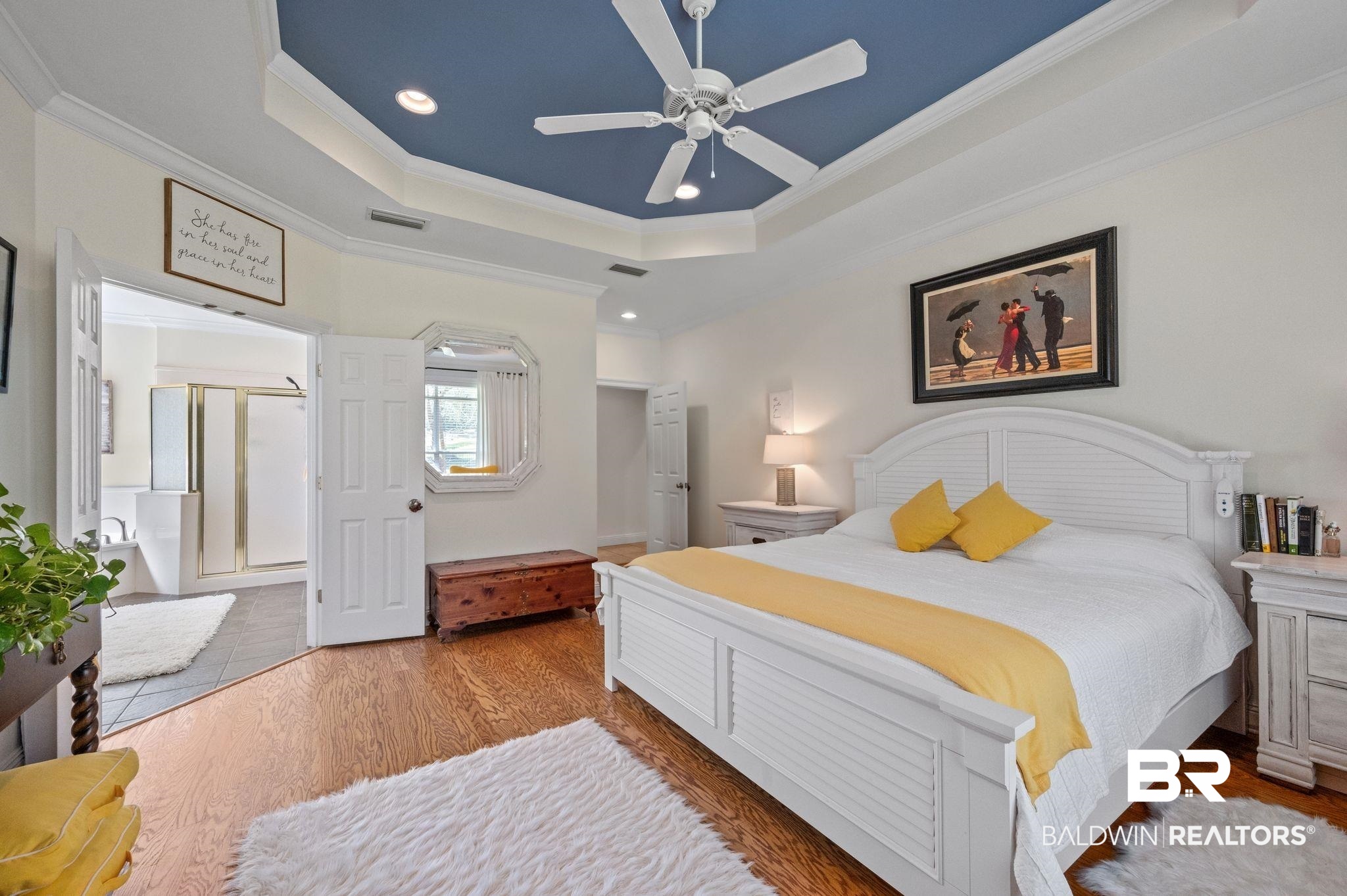30151 Dolive Ridge Daphne, AL 36527 - Photo 12 of 37 Bedroom featuring a tray ceiling, wood finished floors, visible vents, and ornamental molding