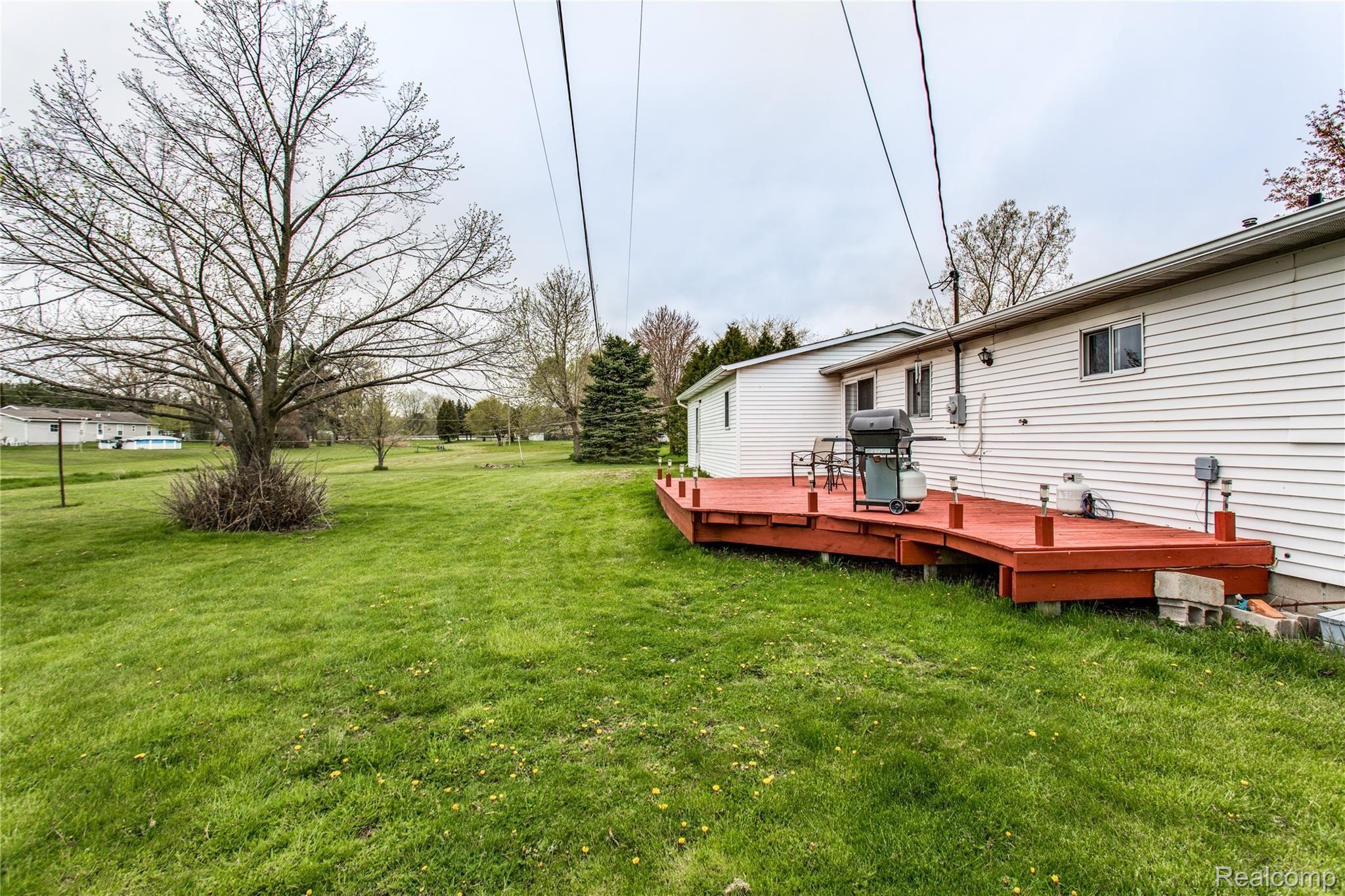 7384 Dian Road Lexington, MI 48450 - Photo 3 of 24 Spacious Back patio with lights.jpg