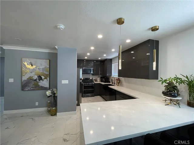 a view of a living room and kitchen