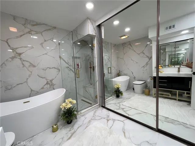 a bathroom with a toilet a sink and a bathtub
